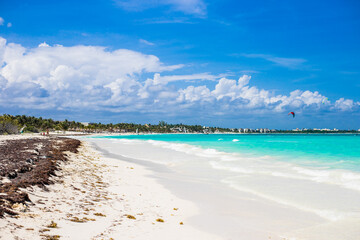 Drone photo of a white sand beach and clear blue water in Cancun, Mexico