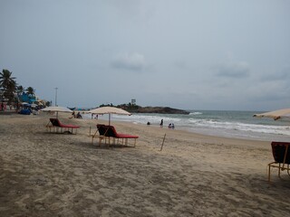 beach chairs and umbrellas on the beach, kovalam beach seascape view Thiruvananthapuram Kerala