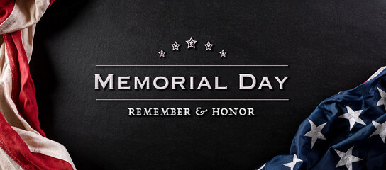 Fototapeta na wymiar Happy memorial day concept made from vintage american flag with text on black wooden background.