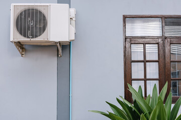 Home Cooling Air Condition Unit and Control System, Air Condenser Engine Station Outside Building of HVAC Systems. Electrical Compressor Fan Coil of Air Conditioning Equipment for Home Residential.