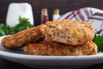 Buckwheat cutlets with cheese and parsley on a plate. Healthy diet food