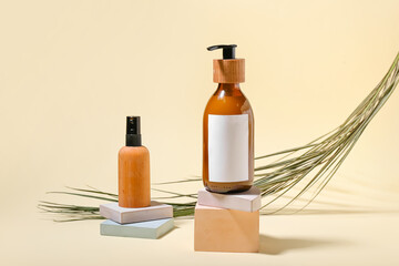 Bottles of natural cosmetics for hair on color background