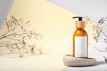 Bottle with natural shampoo on color background