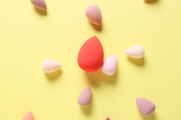 Makeup sponges on color background