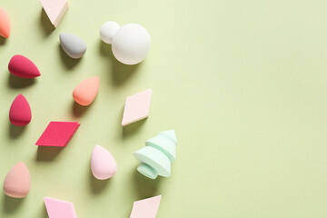 Makeup sponges on color background