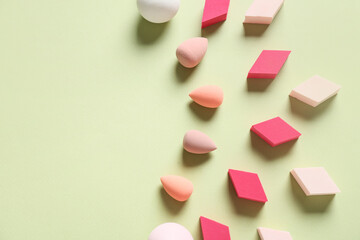 Makeup sponges on color background