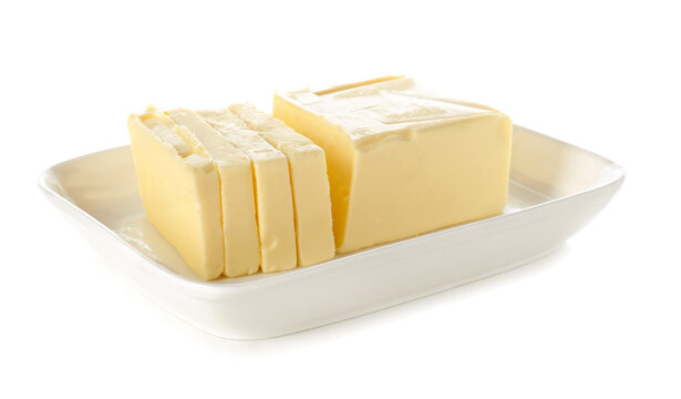 Bowl with fresh butter on white background