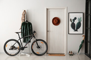 Modern bicycle in interior of hallway