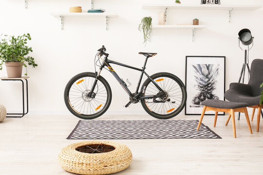 Modern bicycle in interior of light room