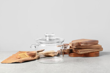 Stylish cooking pot and utensils on table