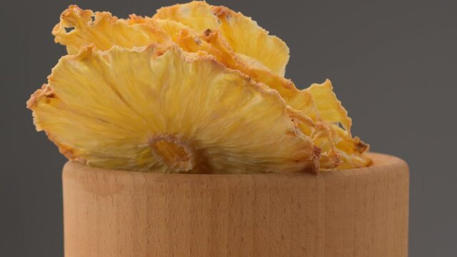 Dried pineapple. Dried pineapples on the table. Dried pineapples on the table.  Rotating Dried Pineapple rings seamless loopable. Dried Pineapple rings seamless. Fresh made Dried Pineapple rings. 
