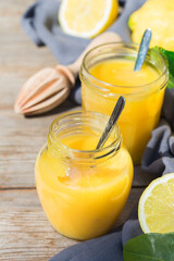 Homemade lemon curd, custard cream with yellow fruits