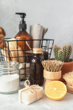 Wooden bamboo brushes, baking soda, lemon, essential oils, vinegar. Zero waste eco friendly cleaning concept. Vertical photo - Image