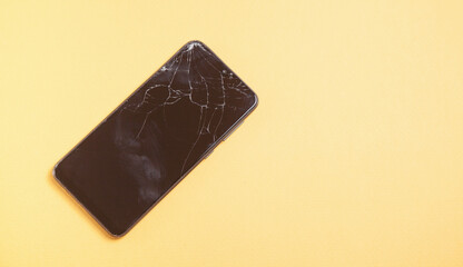 Black broken smartphone. Broken screen