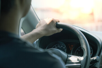 Man with car steering wheel is ready on the move in the modern life style.