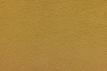 Yellow plaster facade texture background. External facade of the building, plaster with clear texture.