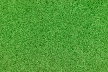 Fototapeta na wymiar Green plaster facade texture background. External facade of the building, plaster with clear texture.