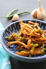 Dry Bombay duck fried with chili and garlic. Dried Bombay duck masala. also known as suke bombil masala in Marathi. Dried bombil chutney. Dehydrated bombil fish. Copy space.