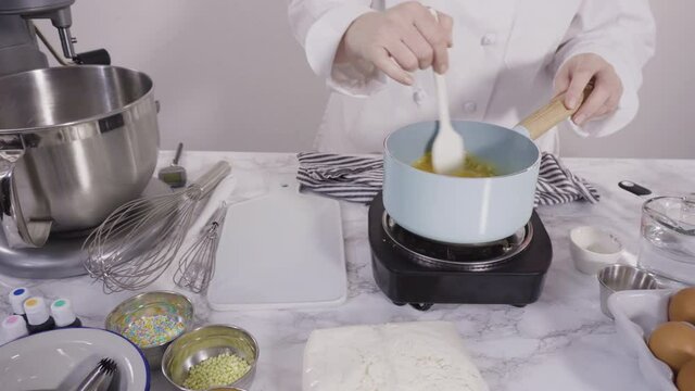 Time lapse. Mixing ingredients to bake sheet cake with Italian buttercream frosting.