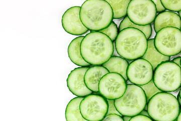Cucumber slices, shot from the top on a white background