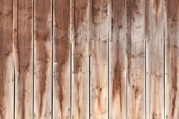 Brown wood background with weathered planks with fading colors