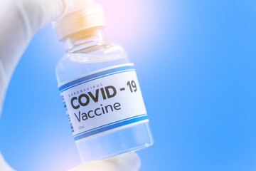 Vaccine concept in the hand of doctor white vaccine jar with copy space. Vaccine Concept of the...