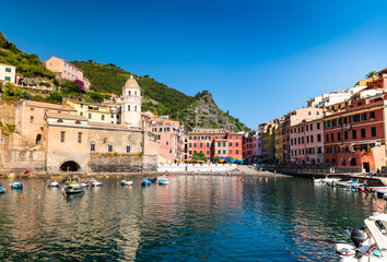 Vernazza, Liguria,Italy. The small port of this characteristic seaside village is characterized by the colorful houses that overlook the sea and the hill immediately behind. Famous tourist destination
