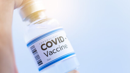 Vaccine concept in the hand of doctor white vaccine jar with copy space. Vaccine Concept of the...