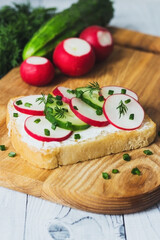 Sandwich with cream cheese, radish, cucumber and green onions