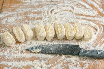 Woman making dough at kitchen