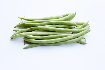 Green beans on white background.