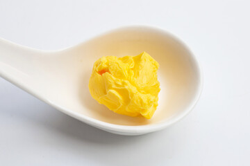 Margarine cheese butter in spoon on white