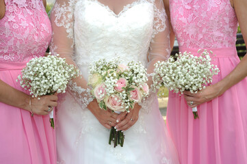 bridesmaids and bride holding their bouquets 