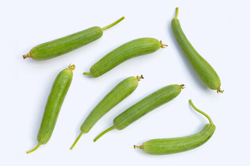 Fresh green sponge gourd or luff on white