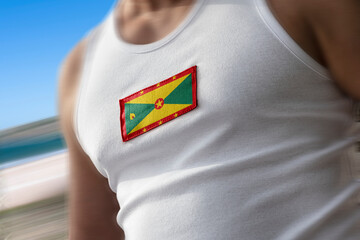 The national flag of Grenada on the athlete's chest