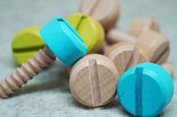 colored wooden screws bolts repair tool children's toy interesting background wallpaper 