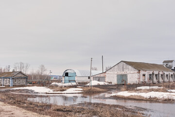 abandoned farm in spring during floods. Empty country lands.
