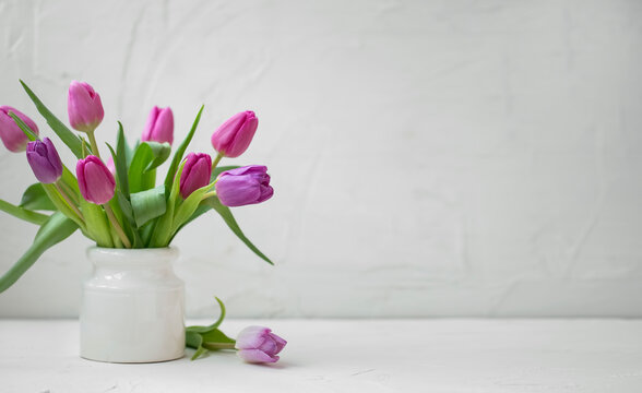 Spring tulips bouquet in white vase