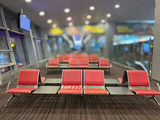 Airport seats in the waiting room during a pandemic. Tourism and travel concept.