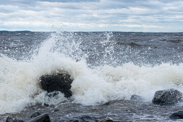 Storm waves on shore with rocks in Finland