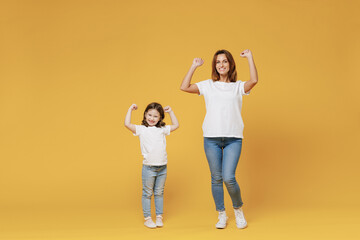 Full length happy woman in basic white t-shirt have fun with cute child baby girl 5-6 years old...