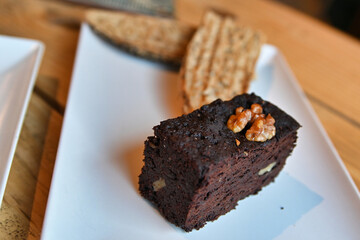 Chocolate brownie. breakfast with brownie, toast, coffee and orange juice.