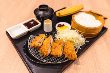Tonkatsu set Japanese food, deep fried breaded pork cutlet with rice, soup and sliced cabbage