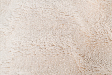 White soft wool texture background, cotton wool, light natural wool, close-up texture  wool with beige tone