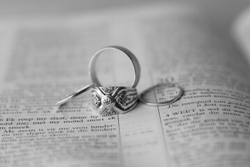 wedding rings on a page of an Afrikaans bible