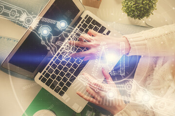 Double exposure of woman hands working on computer and data theme hologram drawing. Top View. Technology concept.