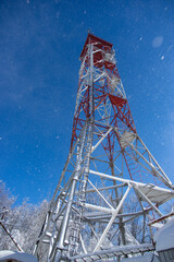 Frozen television or cellular tower in winter in the mountains