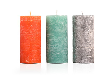 Three different textured candles on an isolated white background