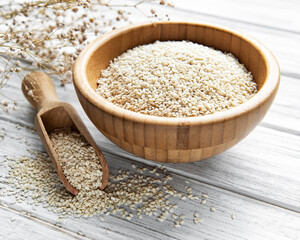 Sesame seeds in a bowl  on a rustic table
