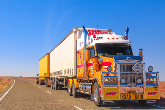 Northern Territory, Australia - August 27, 2019: Mansell group, road-train truck of Kenworth crossing the highways of the Northern Territory of Australian Outback.